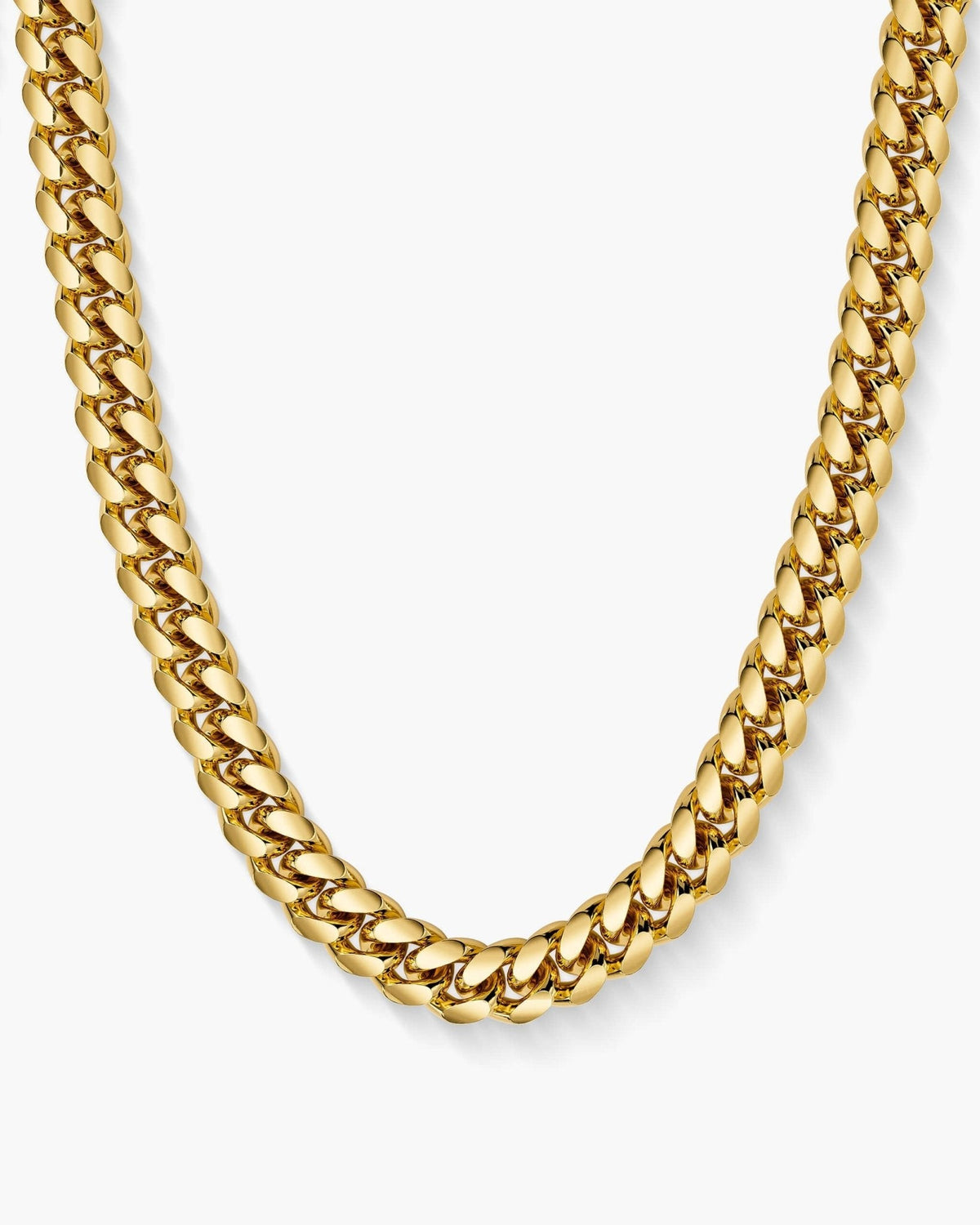 Gold Cuban chain necklace on a white background